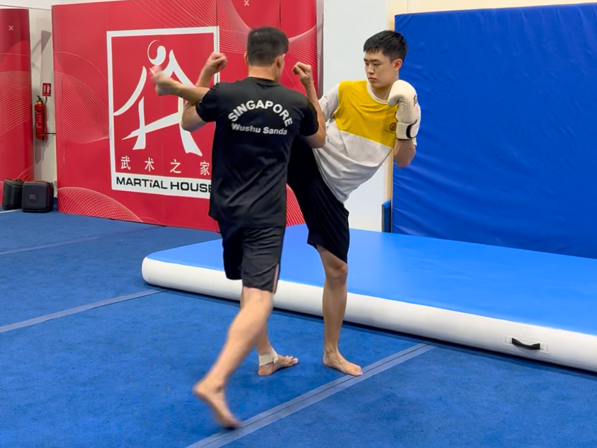 Students practising Sanda combat techniques at Martial House
