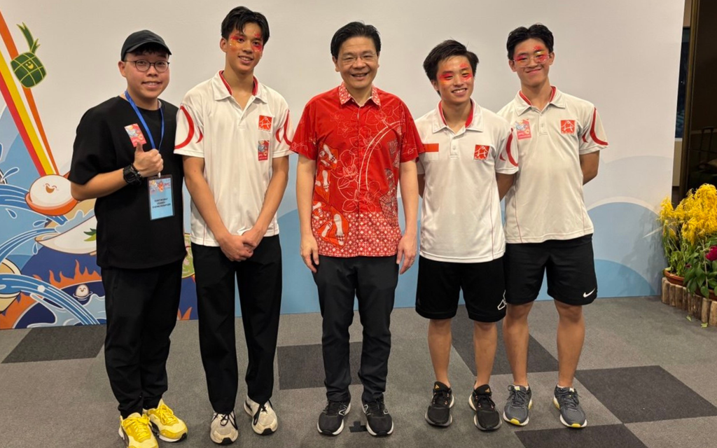 Eason Low with Coach Timothy Chan, Koh Le Bon, Chia Kai Ming and Prime Minister Lawrence Wong