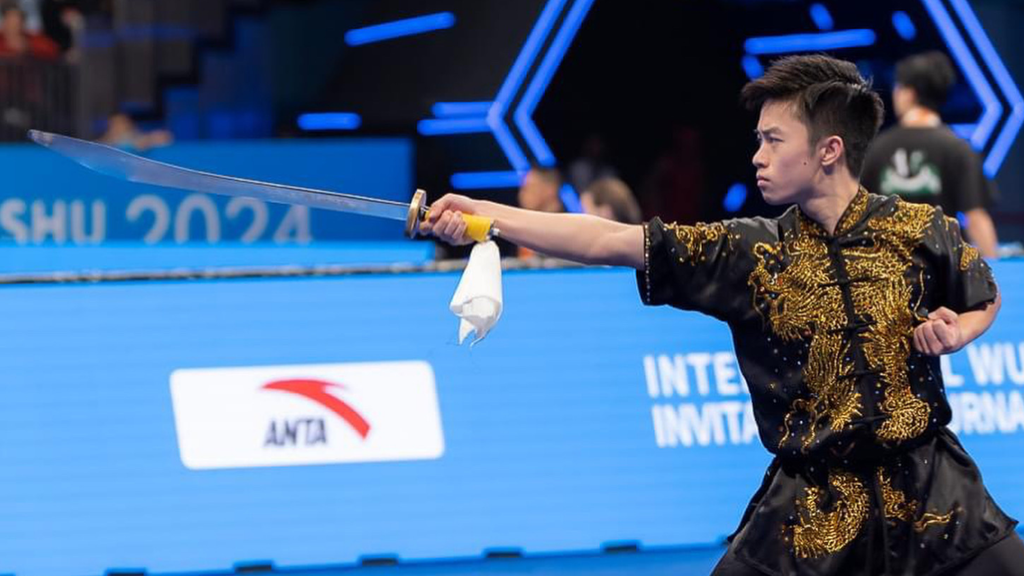 Chia Kai Ming representing Singapore at an international Wushu competition